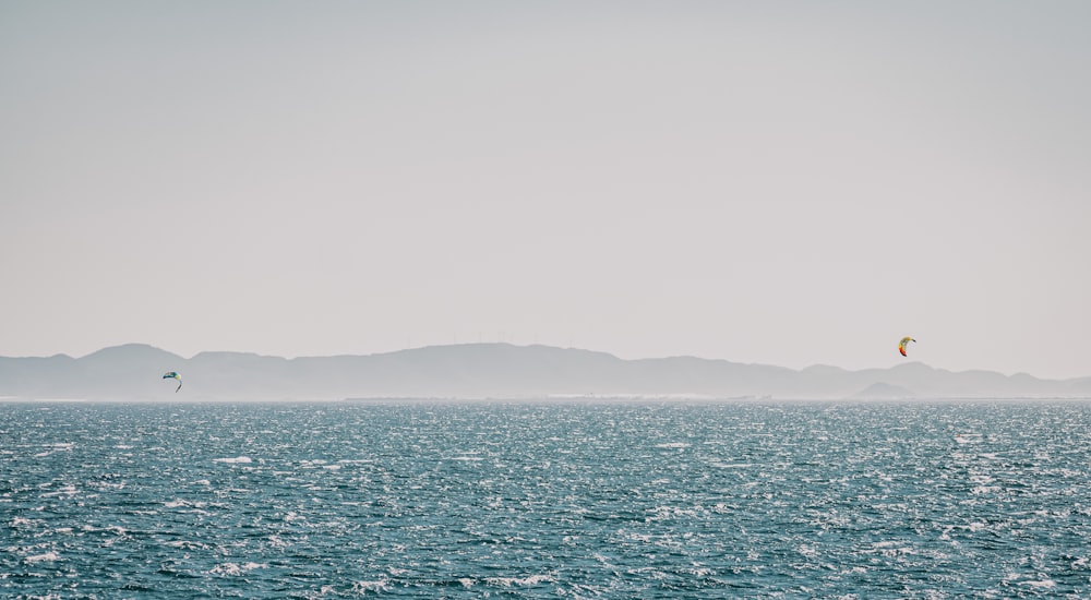 body of water under gray sky