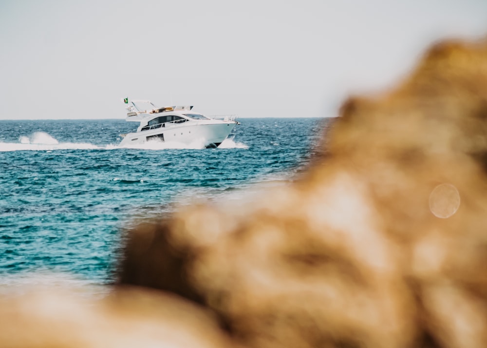 white and black ship on sea during daytime