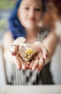 woman in white wedding dress holding bouquet of white flowers