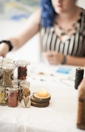 A calm setting with a journal, herbal tea, and natural supplements on a wooden table.