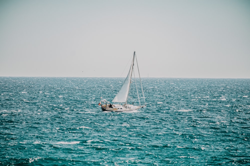 white sailboat on sea during daytime