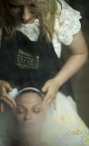 woman in black and white shirt carrying baby