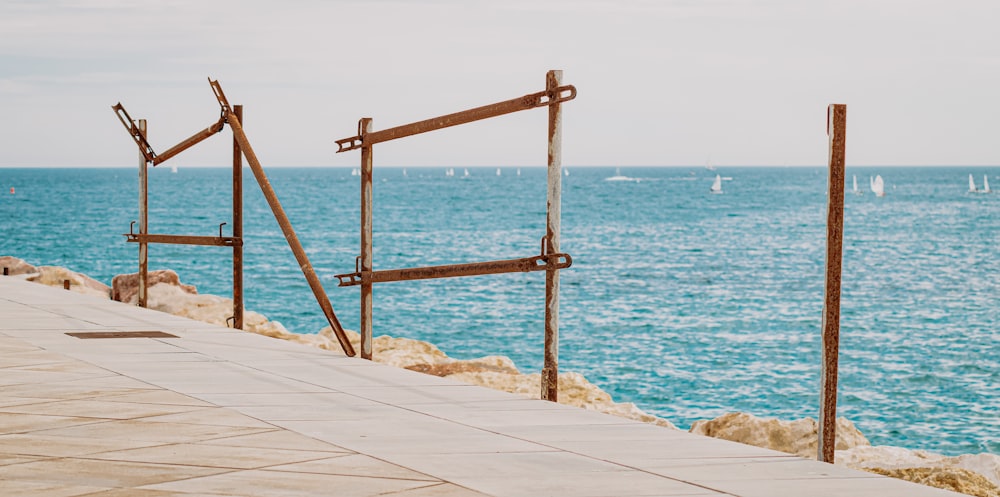 brown wooden ladder on white wooden dock during daytime