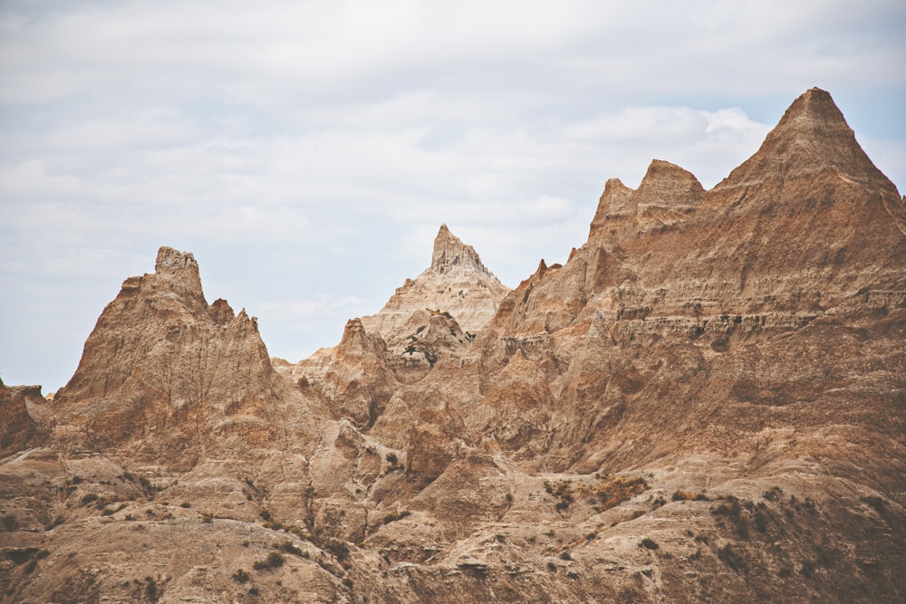 brown rocky mountain under white sky during daytime