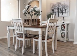 white wooden dining table with chairs