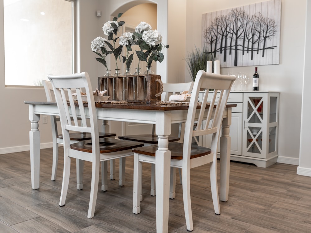 white wooden dining table with chairs