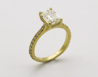 gold ring on white surface