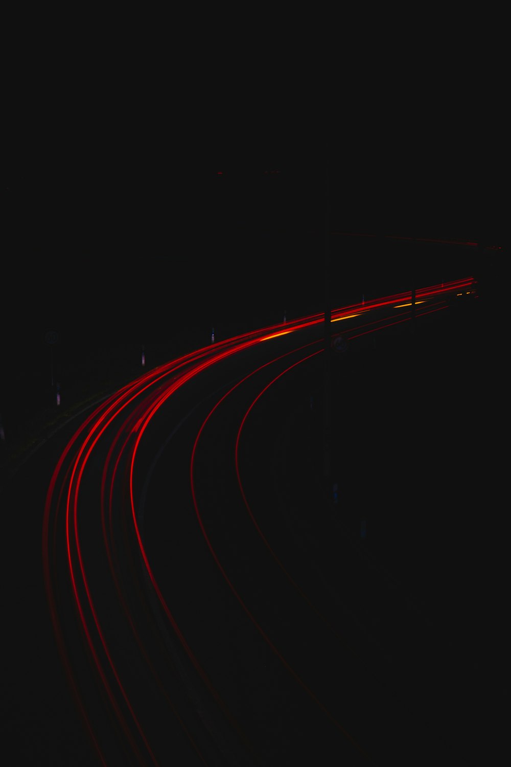 red light streaks on black background