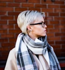 woman in white and black scarf wearing black framed eyeglasses