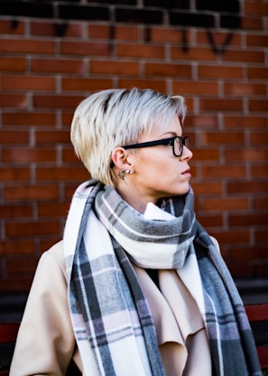 woman in white and black scarf wearing black framed eyeglasses