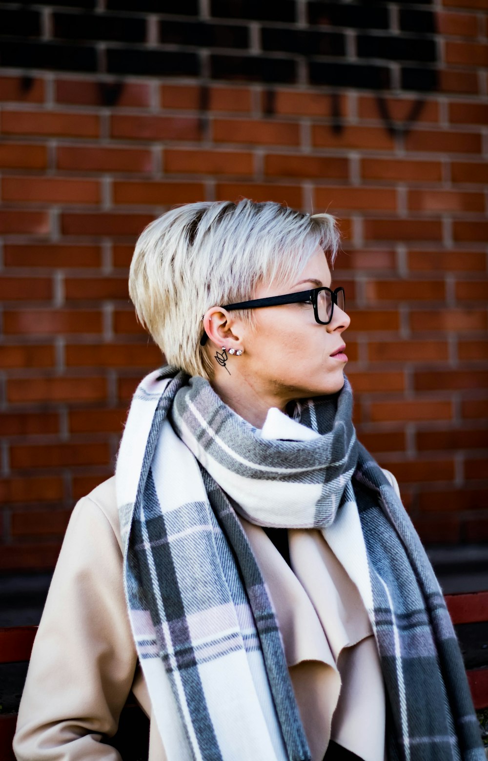woman in white and black scarf wearing black framed eyeglasses