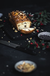 Loaf of bread sliced open showing a rich chocolate and walnut filling
