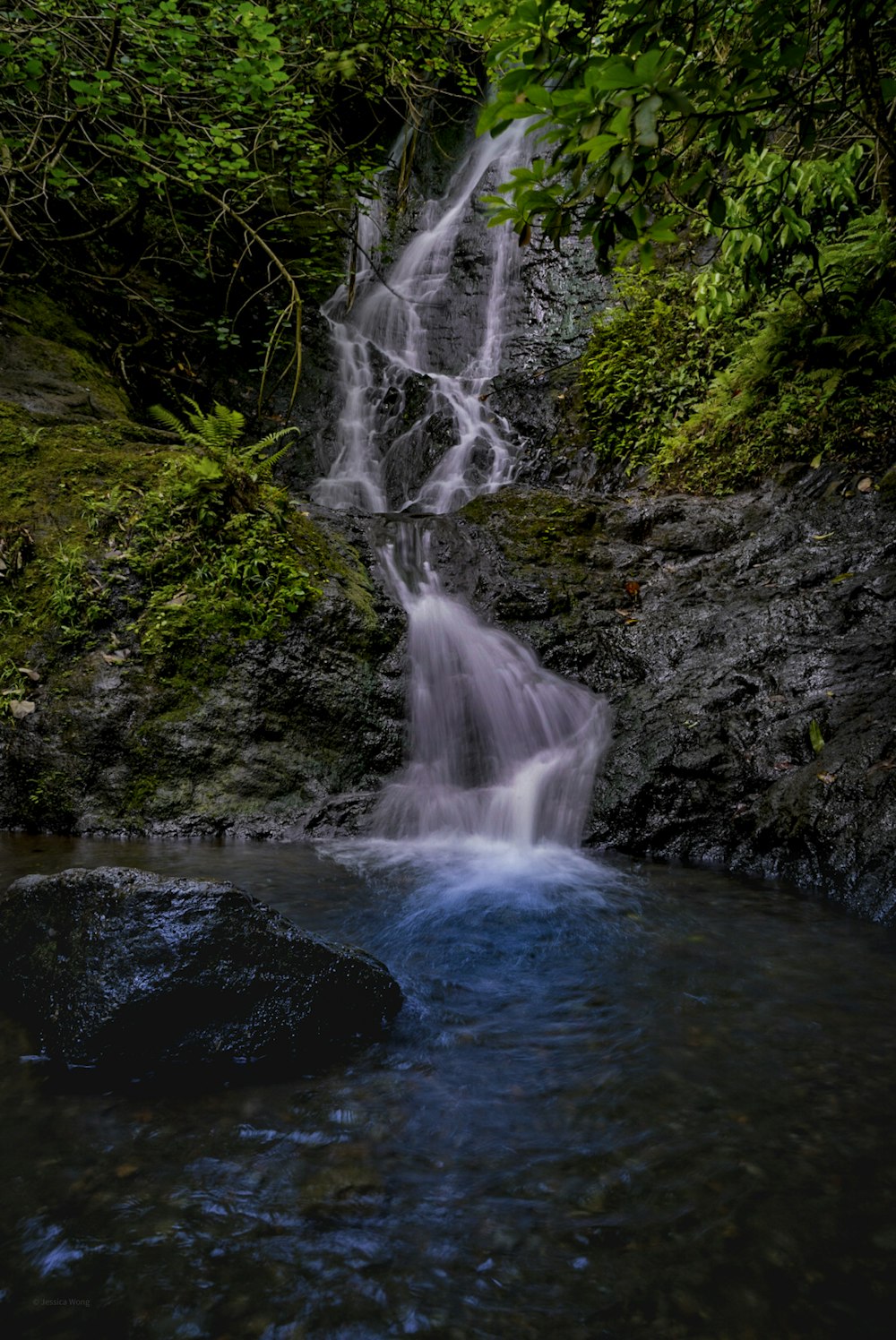 water falls on rocky mountain