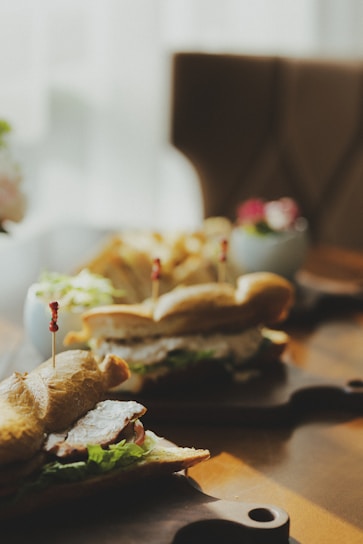 A vibrant photo of a freshly prepared sandwich and salad on a rustic wooden table, capturing the essence of quick, wholesome food.