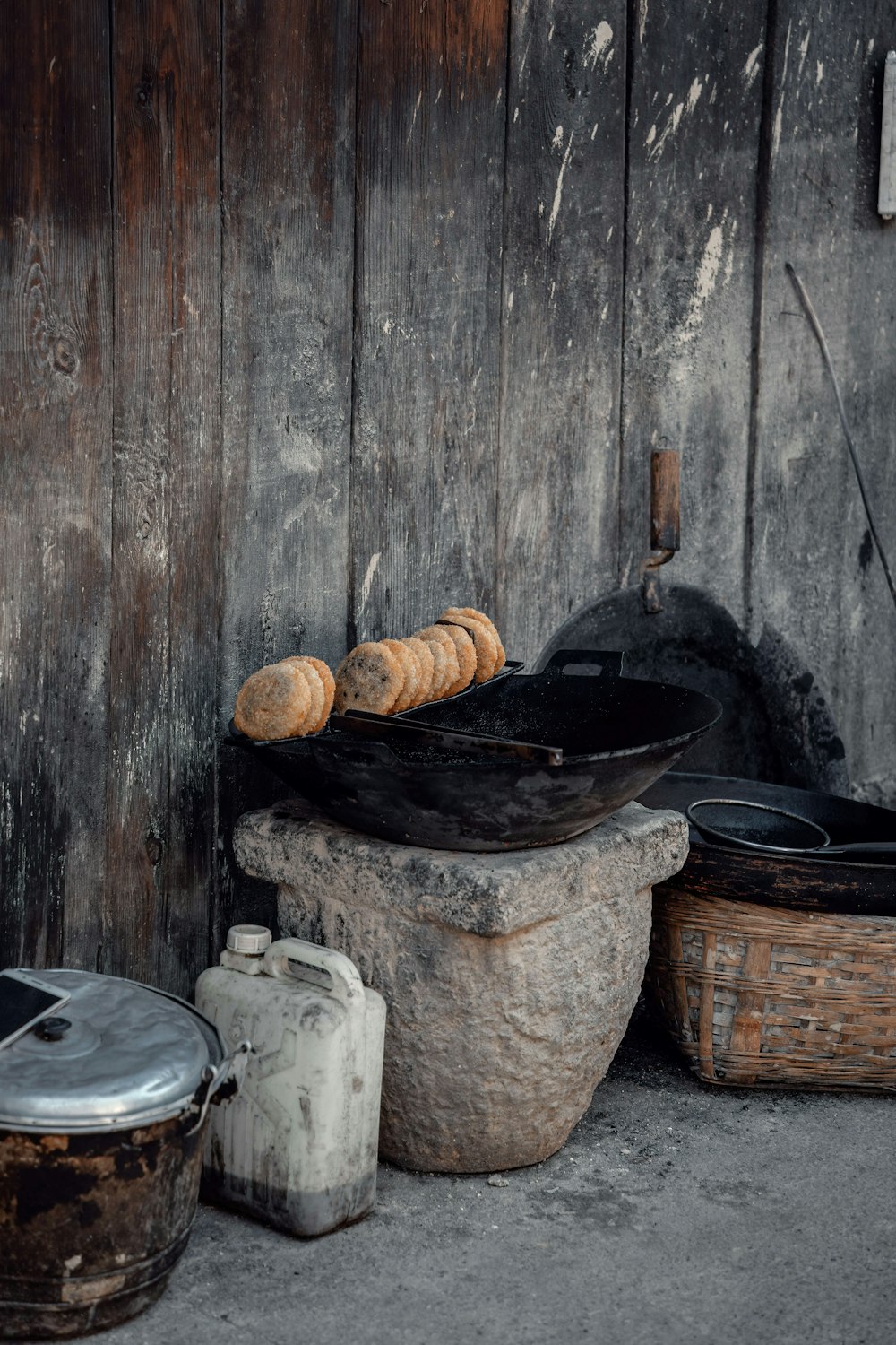 brown wooden round basket with brown wooden stick