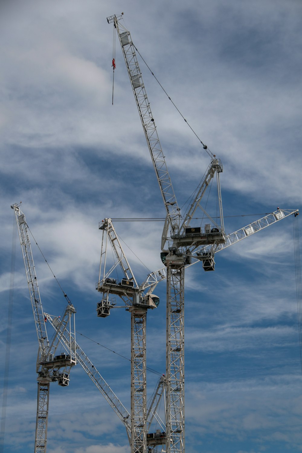 gray metal crane under blue sky