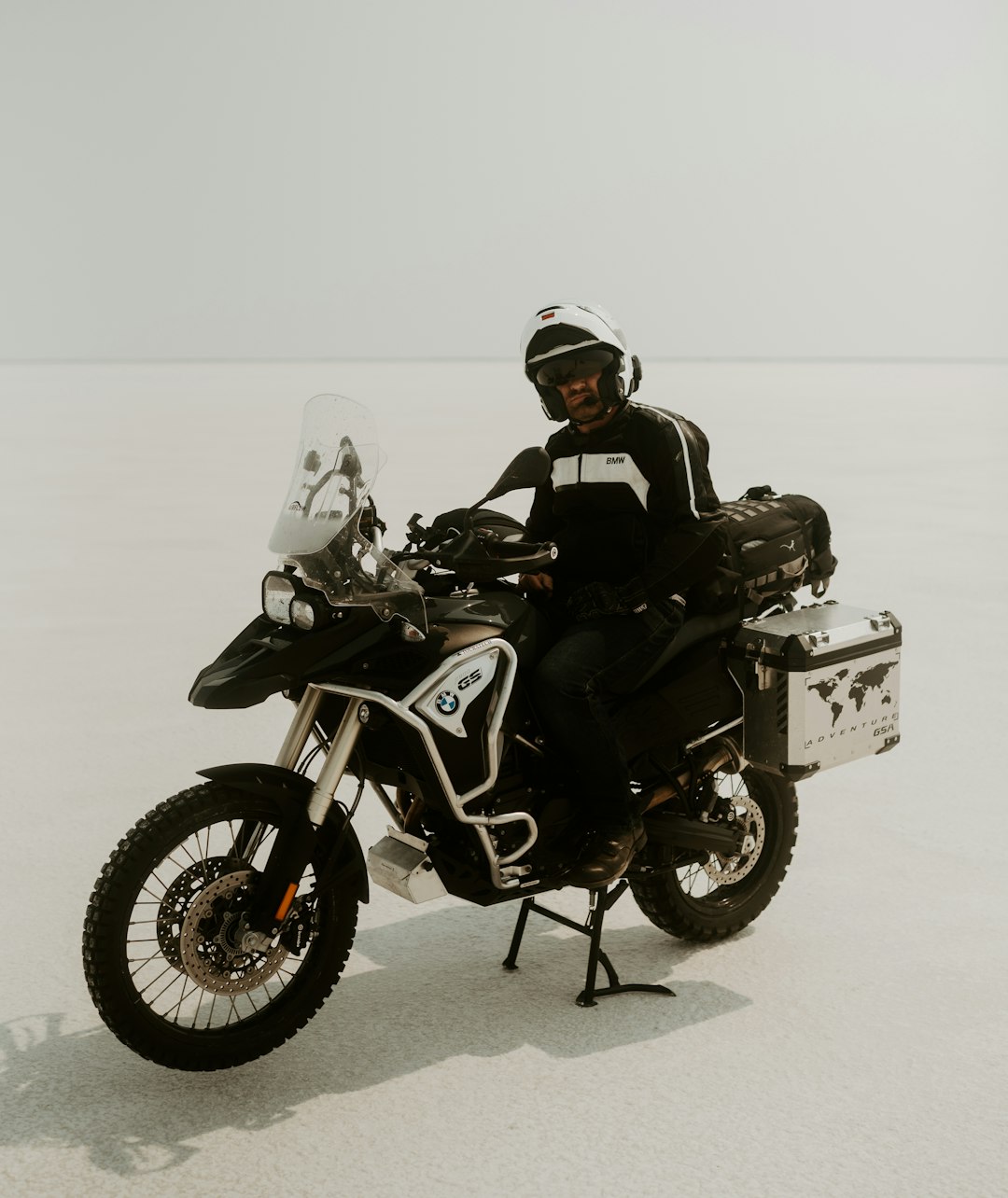 man in black jacket riding black and gray motorcycle