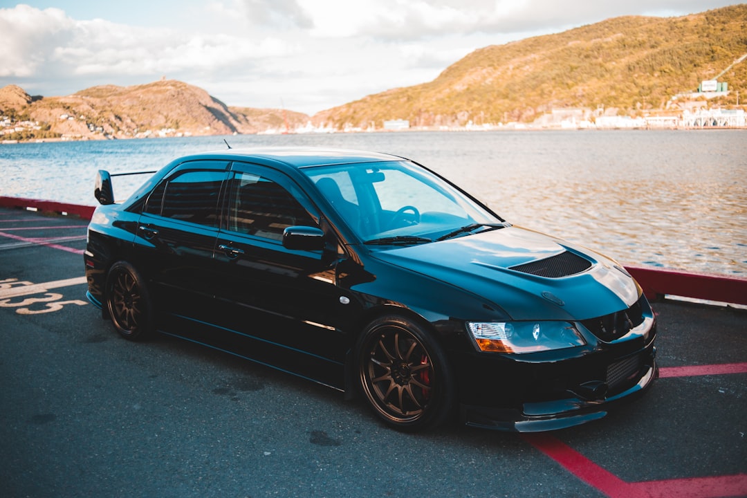 black bmw m 3 coupe on gray sand during daytime