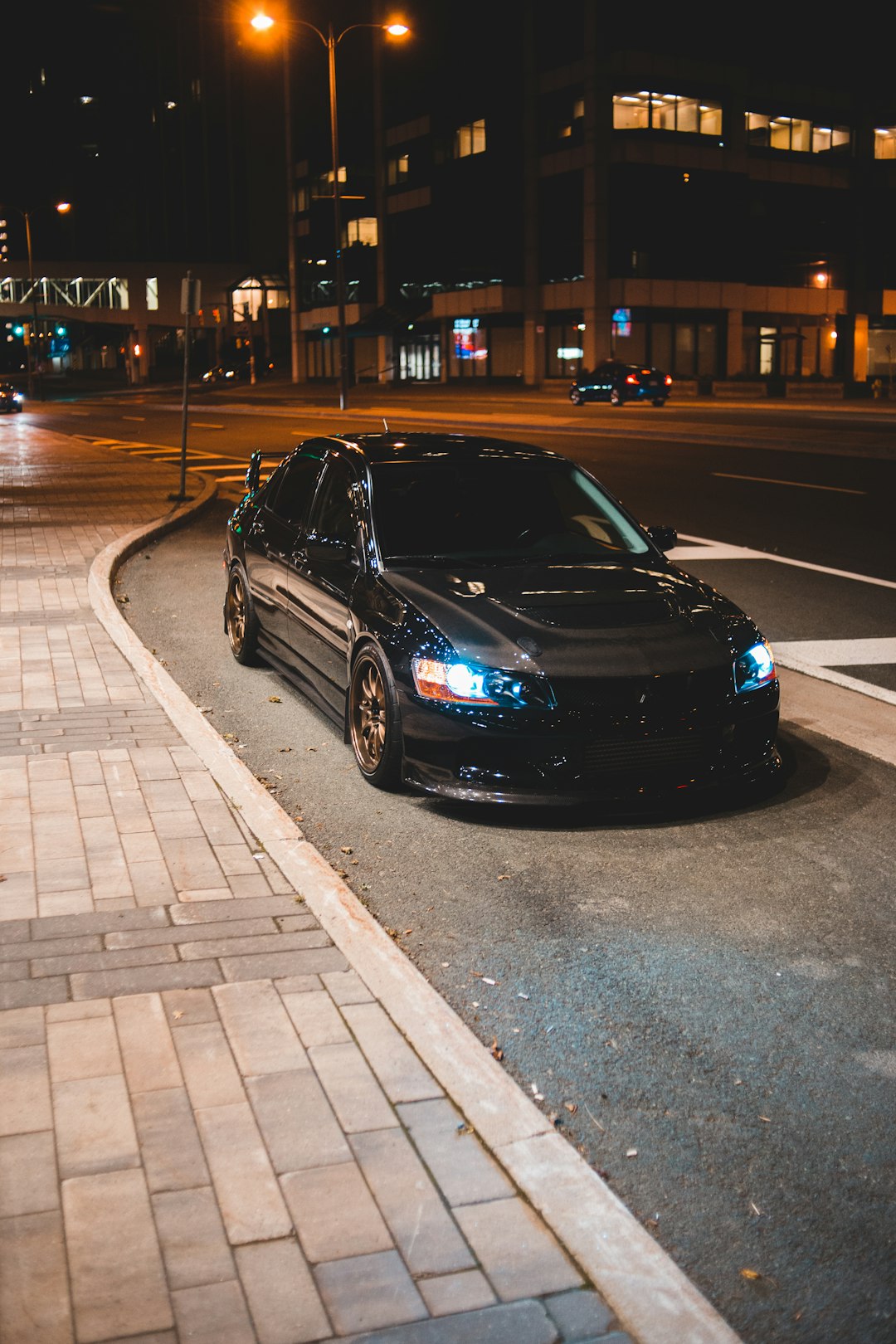 black honda car on road during night time