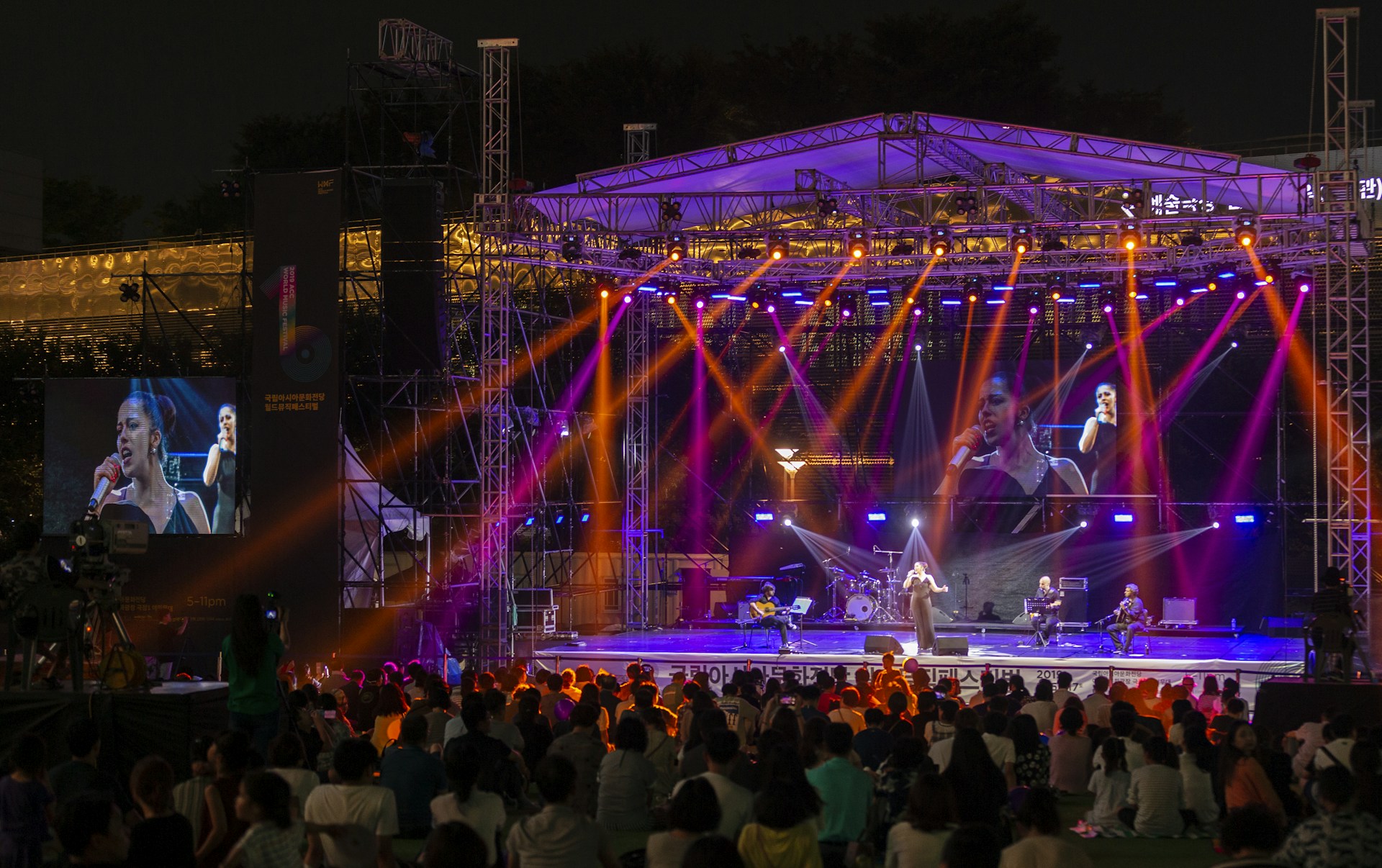 people watching concert during night time