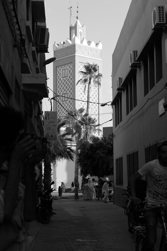 grayscale photo of people walking on street in Taroudant Morocco