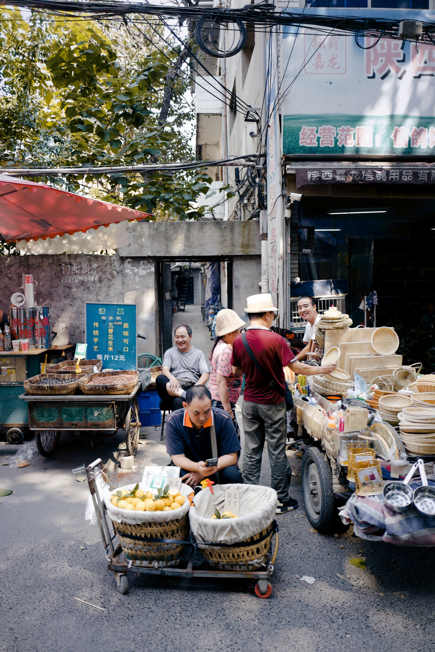 Fruit sellers and handwritten prices at a street market