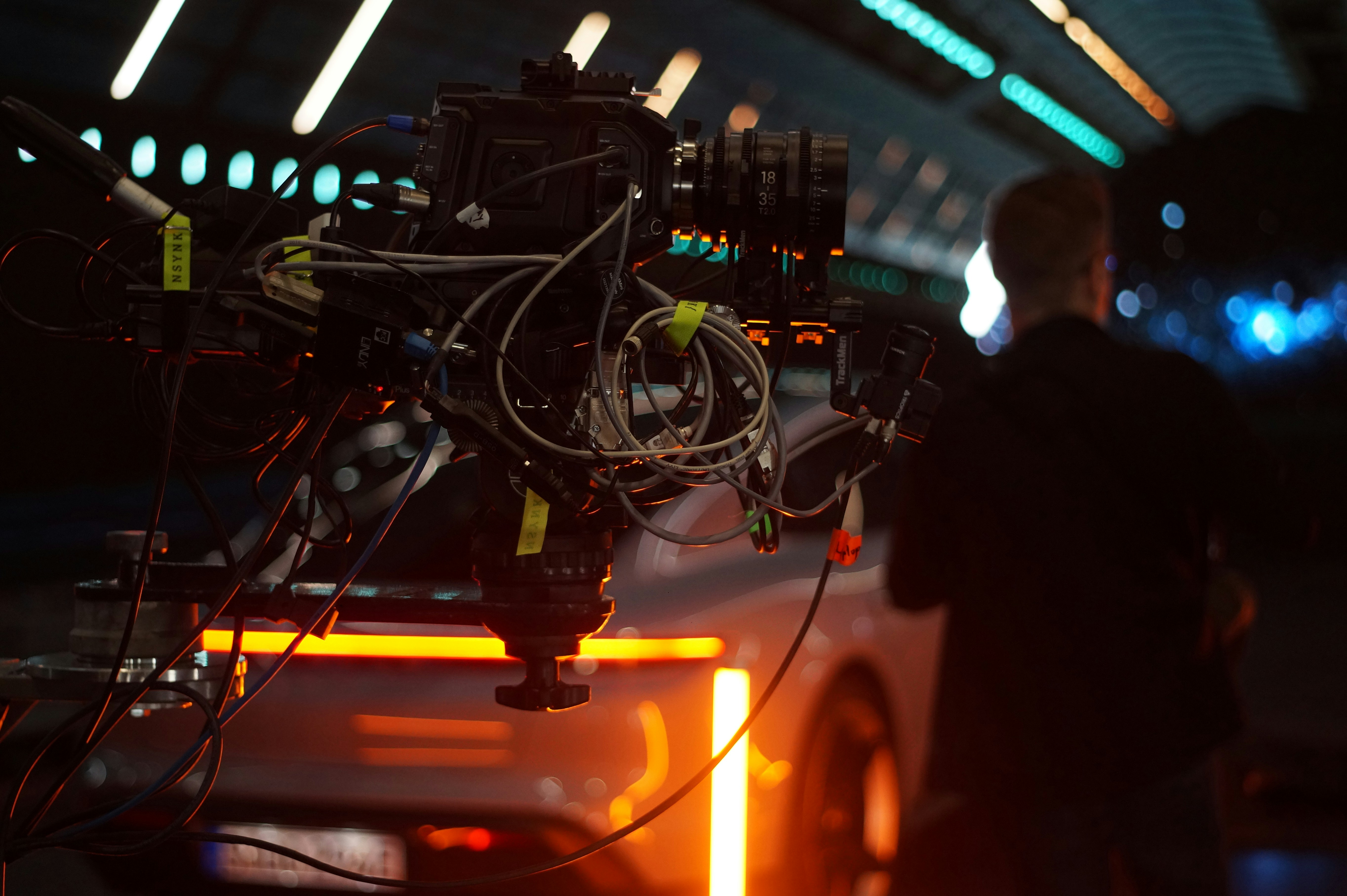 shot on a futuristic filmset with car and amber neon lights