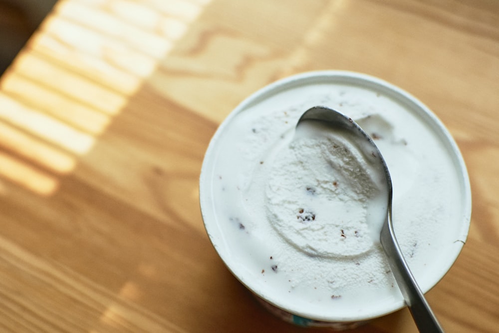 stainless steel spoon on white ceramic plate