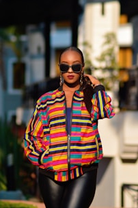 A model showcasing a vibrant spring jacket in a city setting.