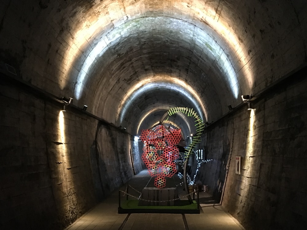 red and black metal chair inside tunnel