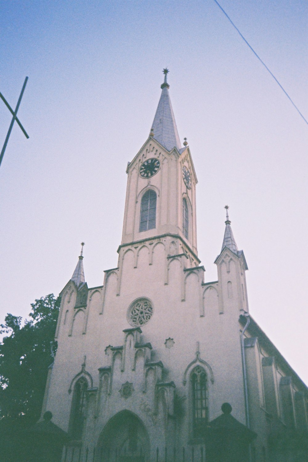 a church with a steeple and a clock on it