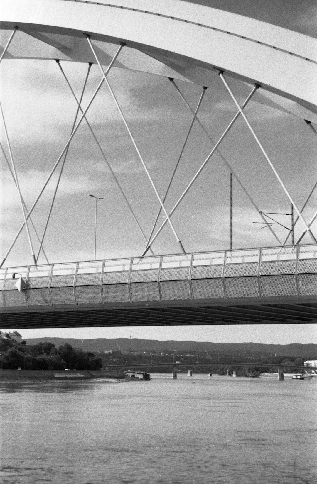 grayscale photo of bridge over river