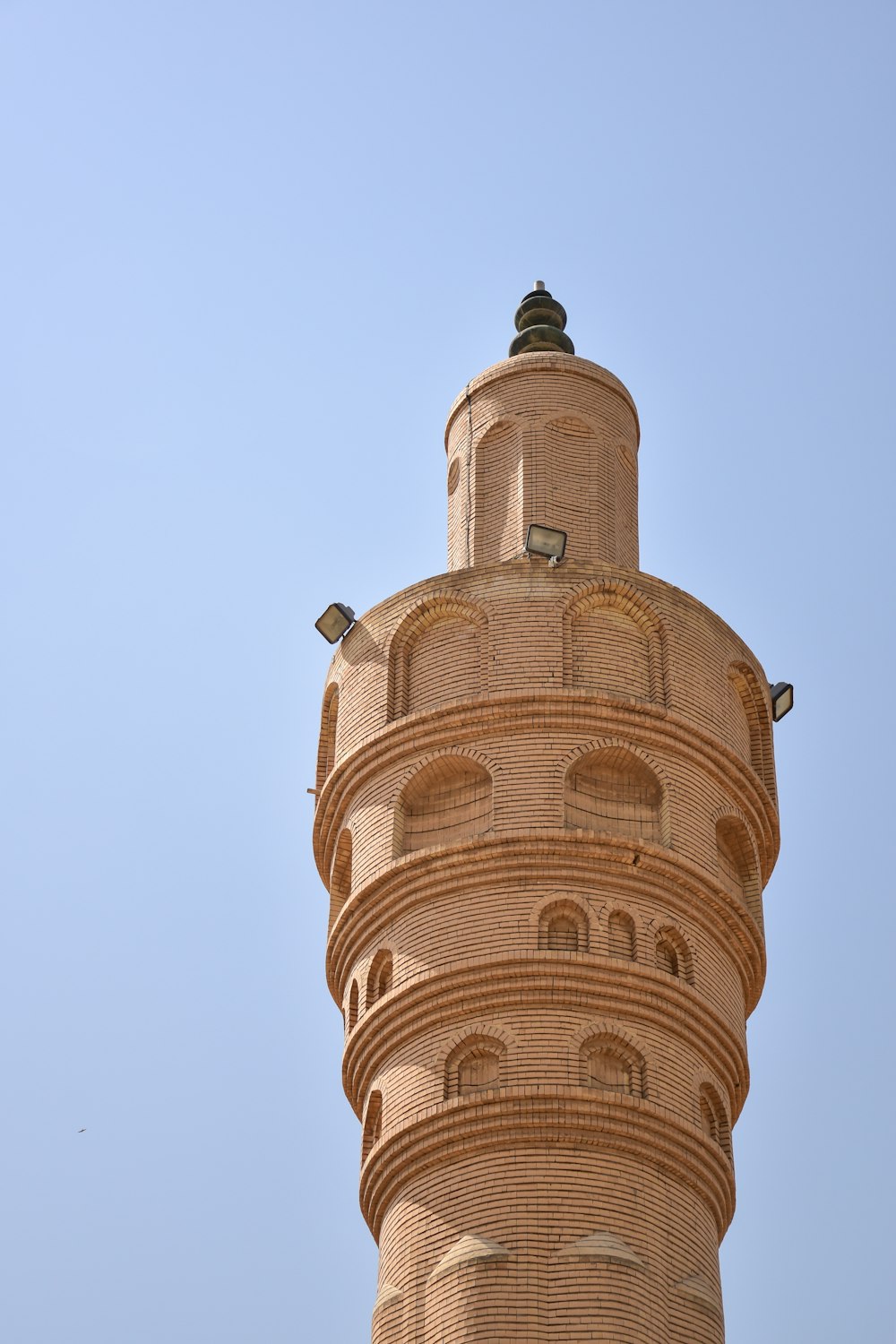 brown concrete tower under blue sky during daytime