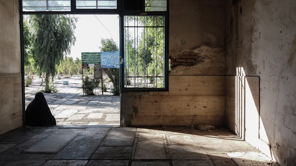 an open door to a building with a sign on it