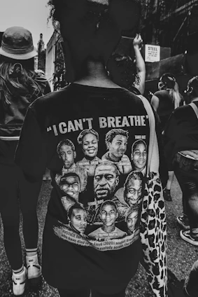 grayscale photo of man in black crew neck t-shirt