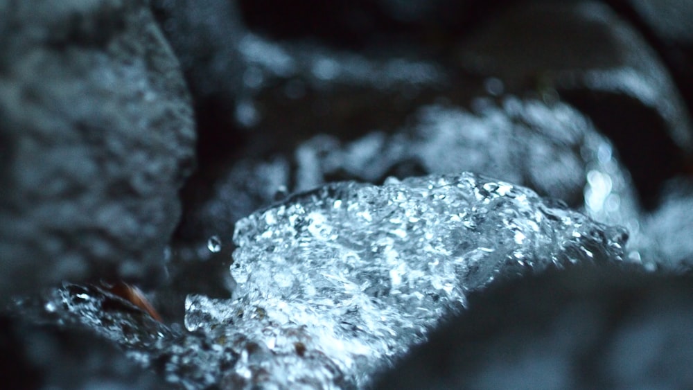 water splash on black rock