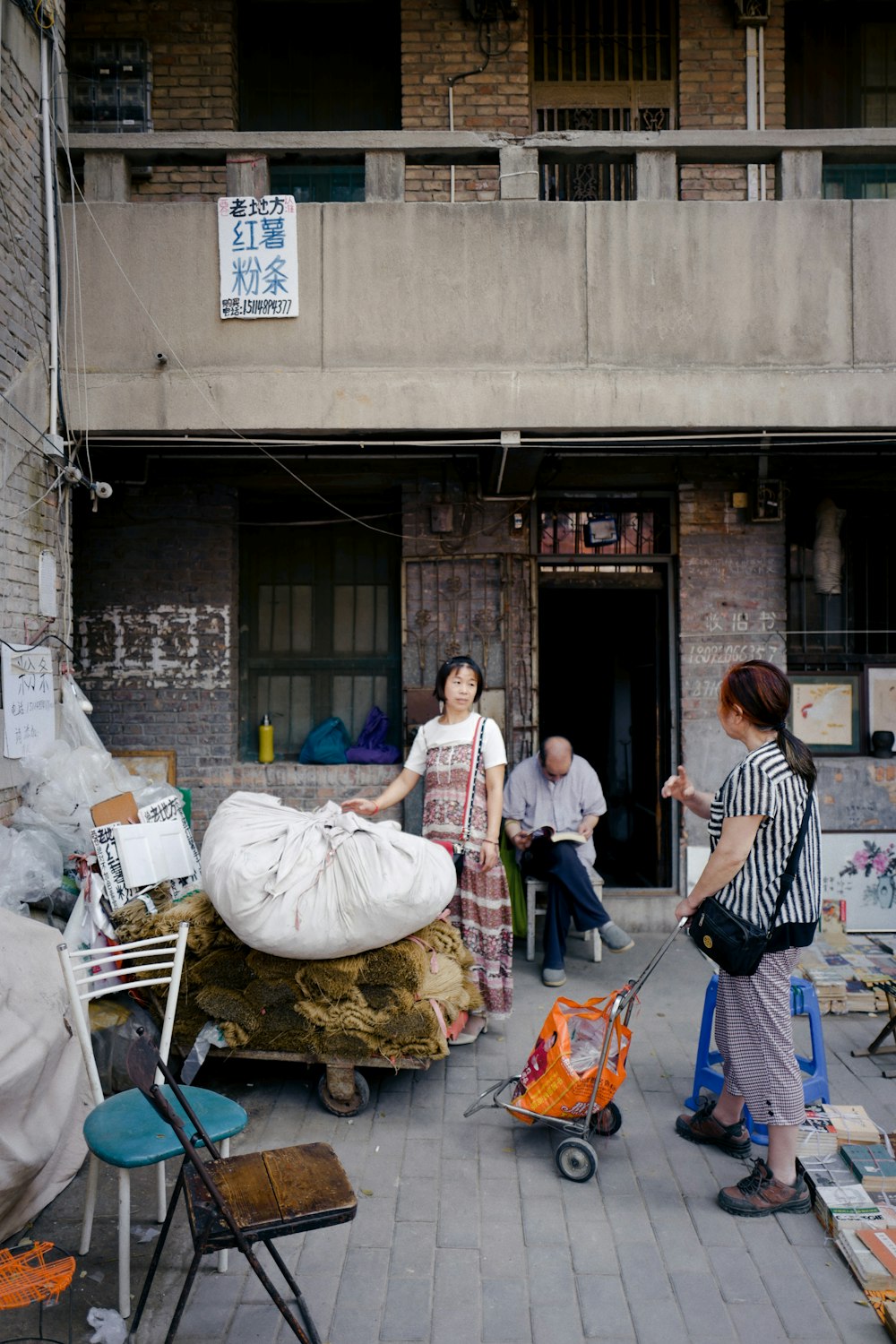 a group of people standing outside of a building