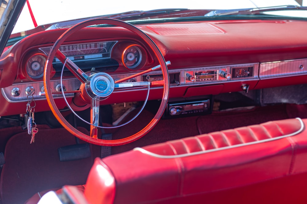 red and black car steering wheel