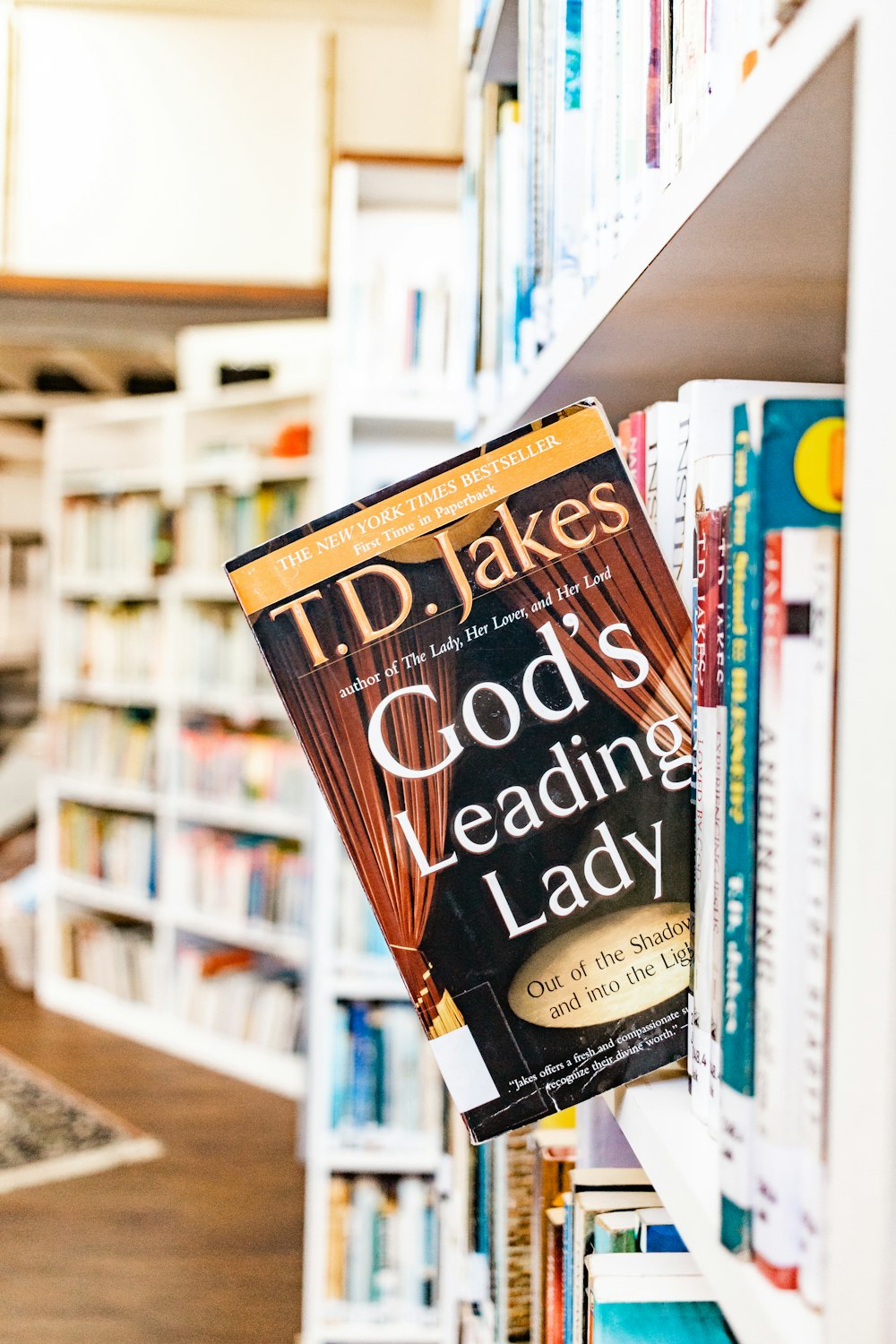 a book on a book shelf in a library