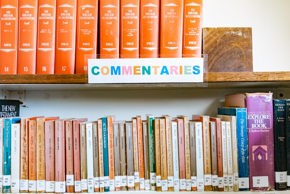 books on white wooden shelf