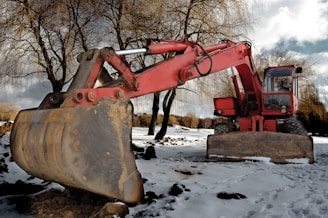 brown heavy equipment on snow covered ground