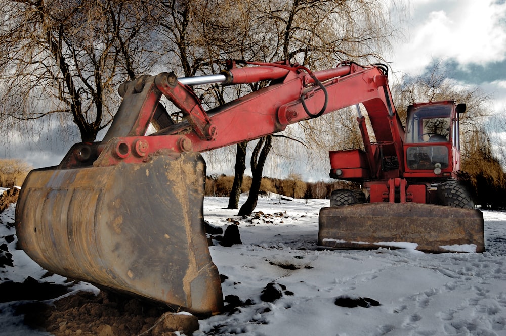 brown heavy equipment on snow covered ground