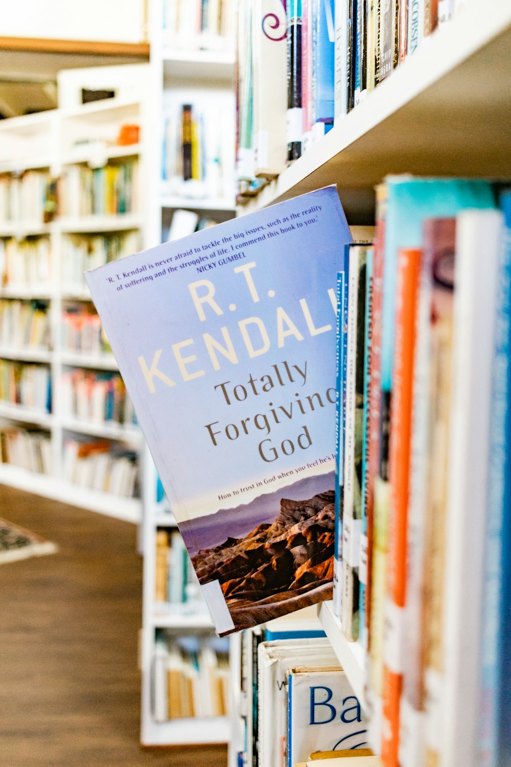 a book on a book shelf in a library