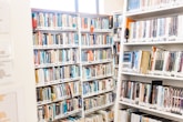 white wooden book shelves with books