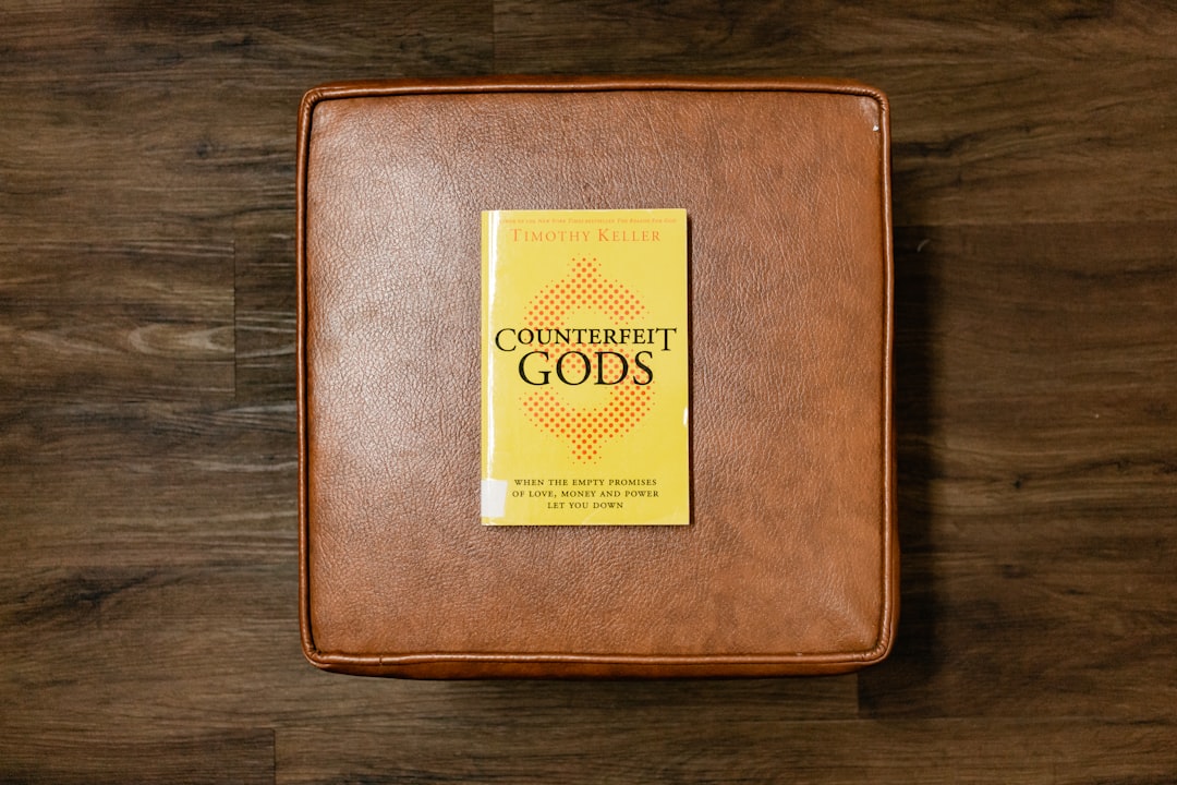 brown leather case on brown wooden table