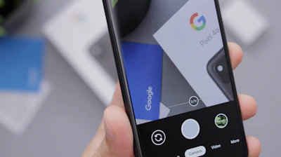 Google Pixel phone held in hand, showing a clear, crack-free display.