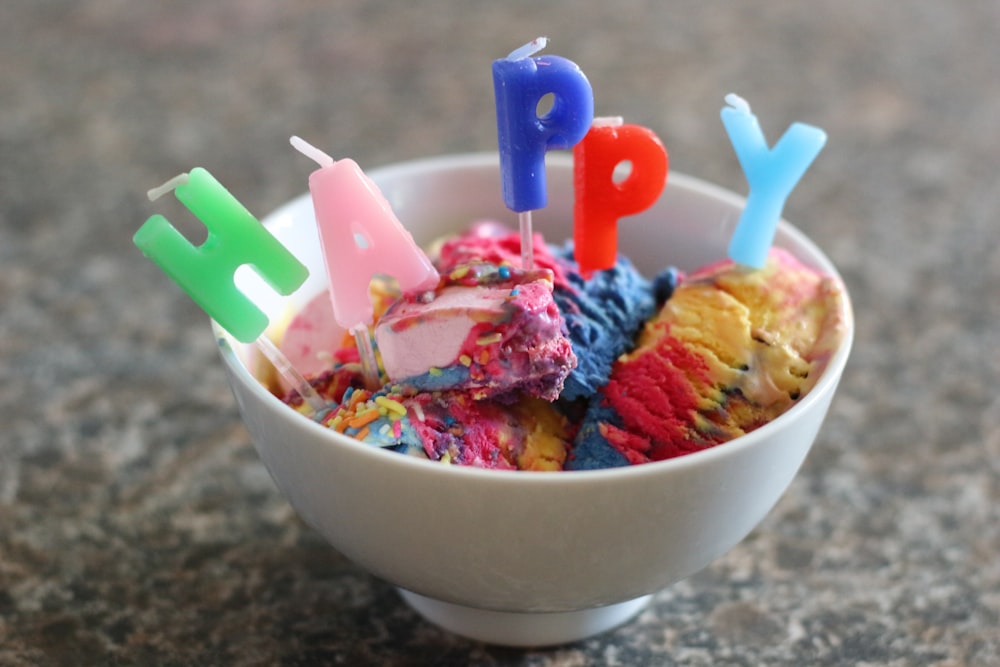 ice cream with sprinkles in white ceramic bowl