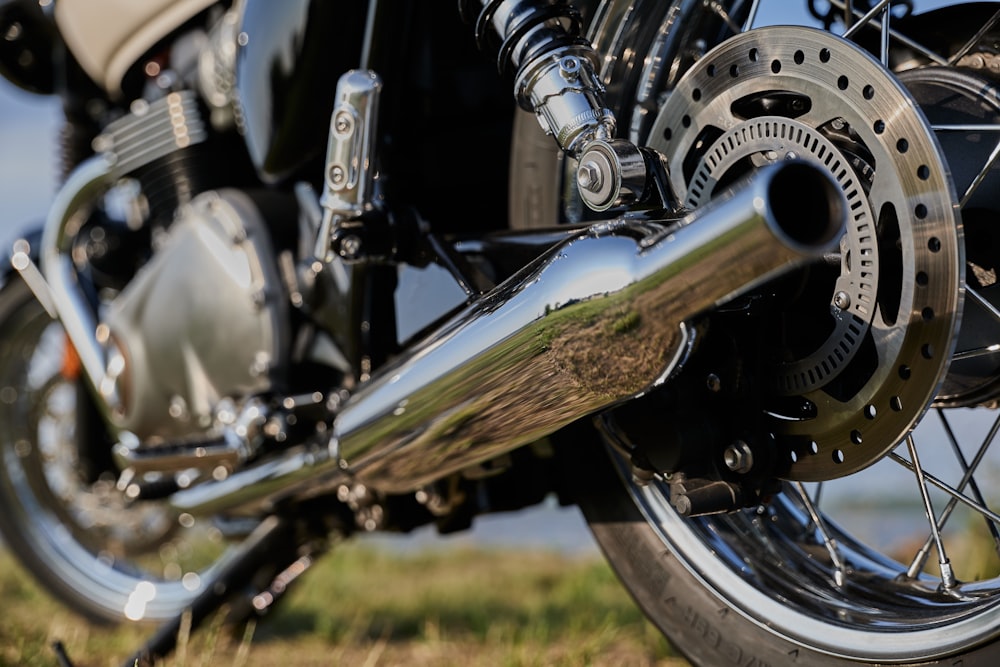 black and silver motorcycle on green grass field during daytime