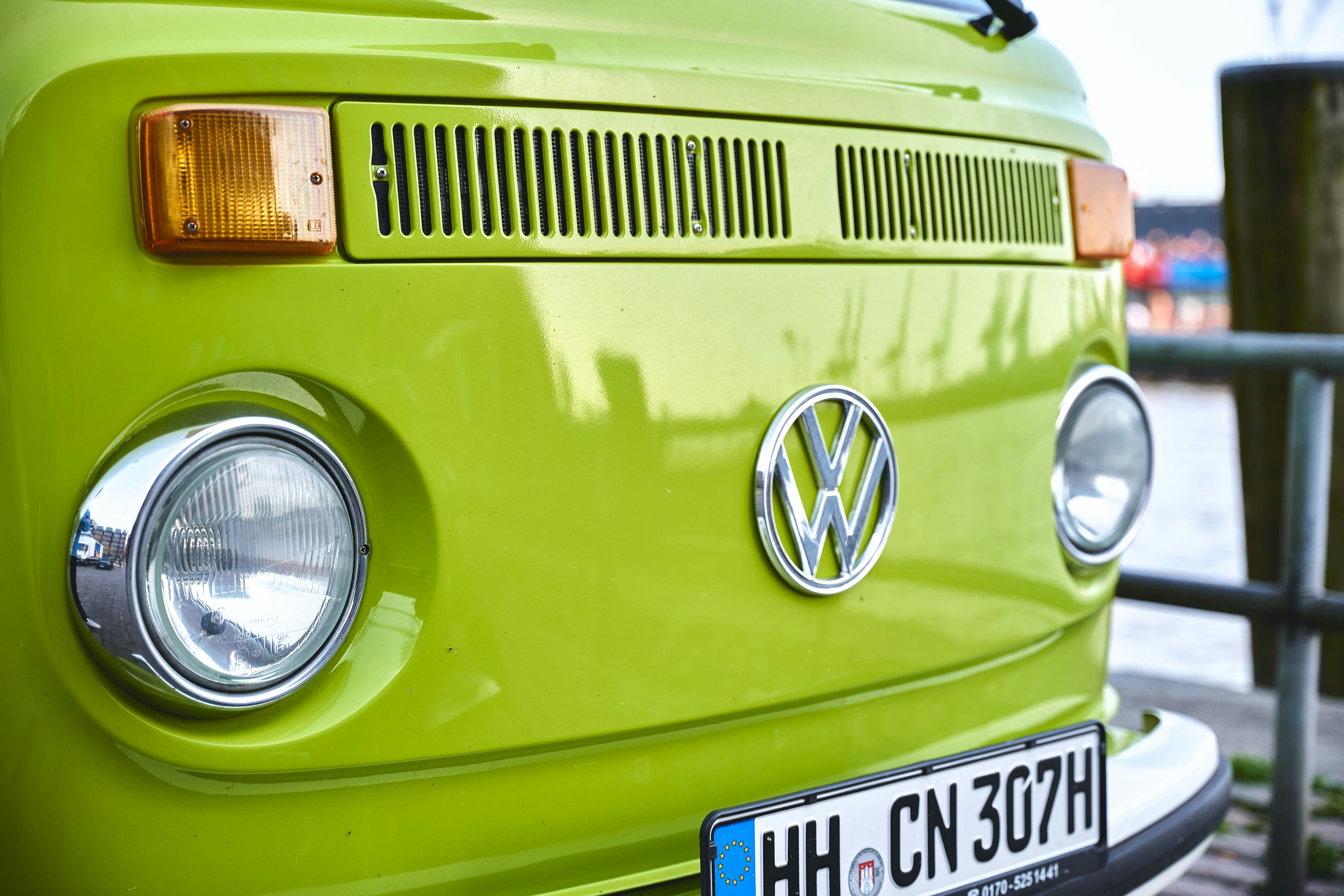 green and yellow volkswagen beetle