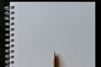 brown pencil on white surface